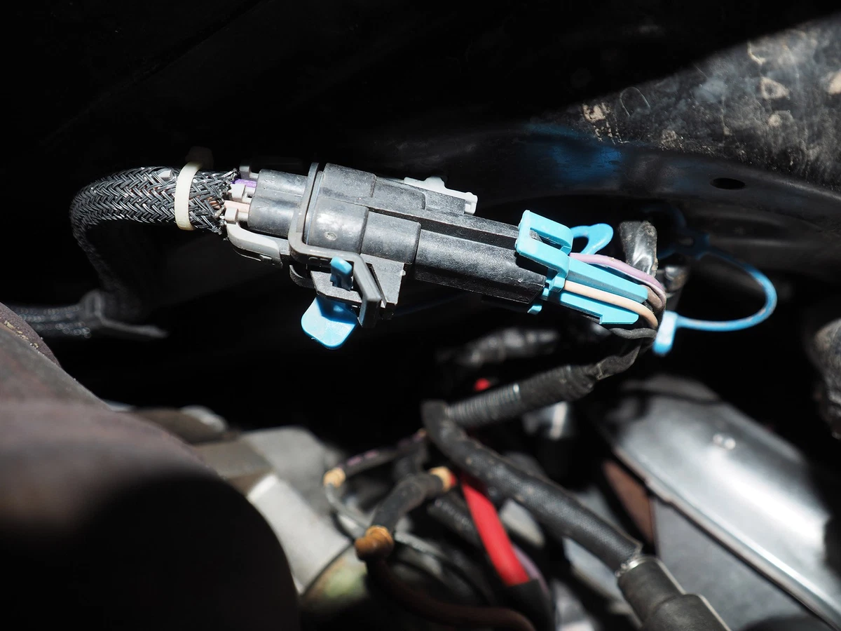 The right side of this harness leads to the oxygen sensor. The wires on the left lead to the engine management system.
