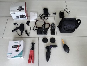 Canon EOS M50 Bundle with Lens, Movo VXR10 Microphone, Batteries, Charger, Bag