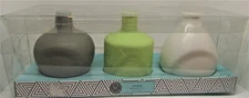 Modern Expressions set of three ceramic 5" vases, new in the box. 