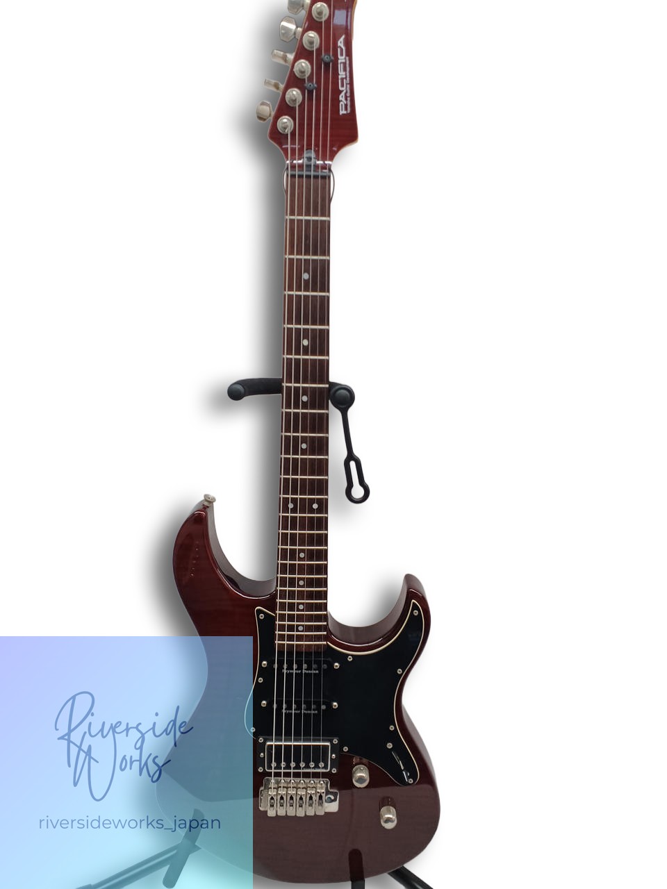 Red YAMAHA electric guitar PAC612VIIFM with gold hardware, black pickguard, and “Riverside Works, Japan” on neck.