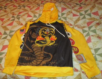 Cobra Kai First Strike No Mercy Yellow & Black Pullover Hoodie Unisex Adult L
