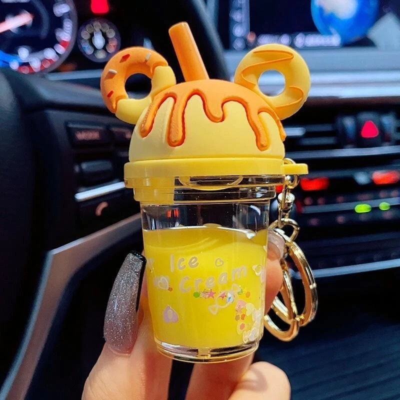 Lindo llavero de taza de té de leche de dibujos animados con líquido flotante - Perfecto para parejas Foto 3 de 4