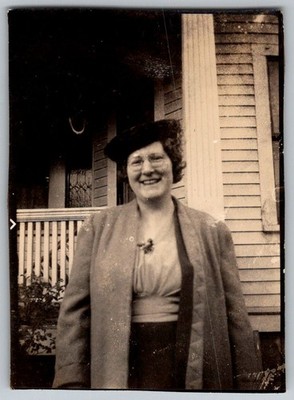 Vtg B&W Snapshot Smiling Woman Wearing Hat Glasses & Coat On Porch House 1930s