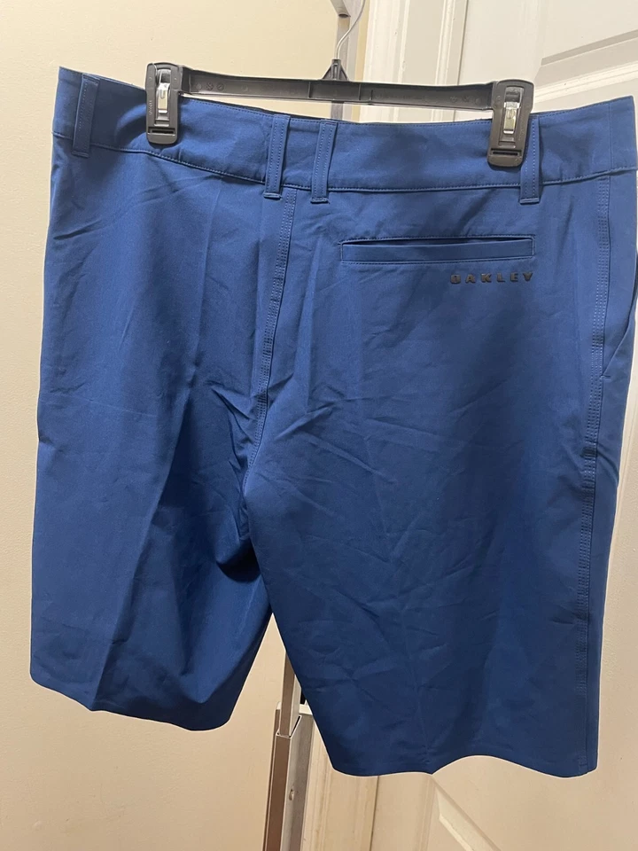 Pantalones Cortos Híbridos Oakley Para Hombre Frente Plano 5 Bolsillos Azul Oscuro 442533 Talla 34 S315 Foto 2 de 4