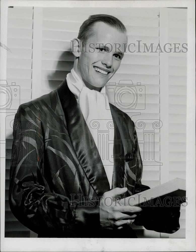 1952 Press Photo Billy Kofoed poses for photo wearing a robe and holding a book