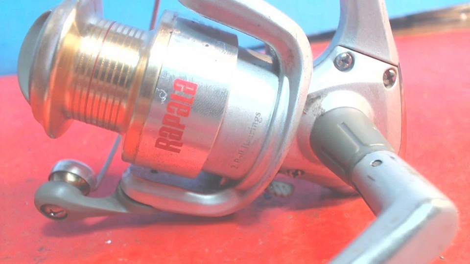 Carrete de pesca giratorio RAPALA-Rap 120 vintage-carrete color dorado-funcionando- Foto 2 de 4