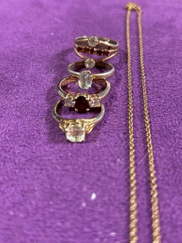 Lot Of Vintage Costume Jewelry. 4 Gold Tone Rings And Chain.