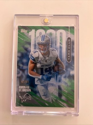 2026 Topps Football Amon-Ra St. Brown 1000 Yard Club Case Hit Green /99 #1YC