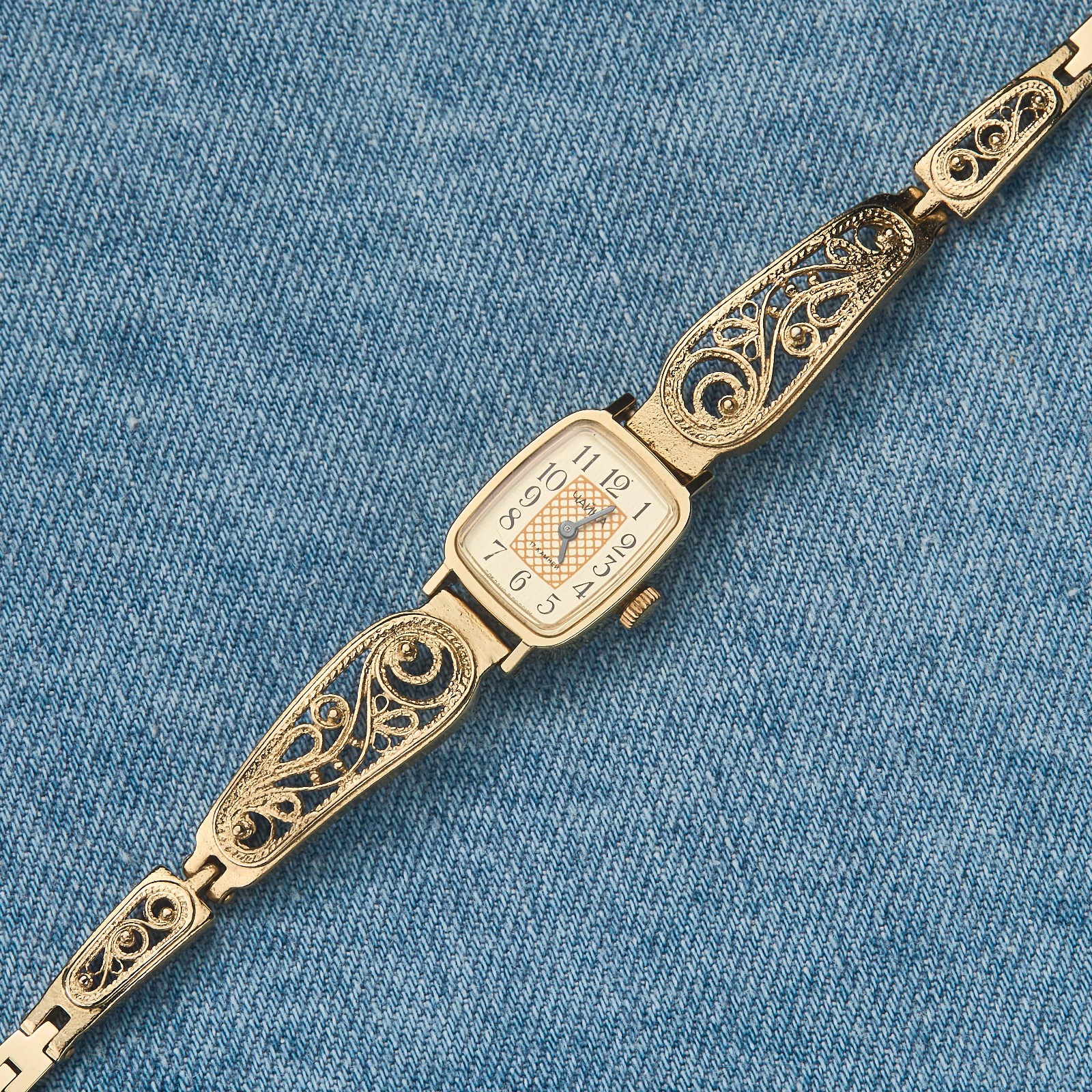 Small women's cocktail watch with gold color. Vintage women's mechanical watch.