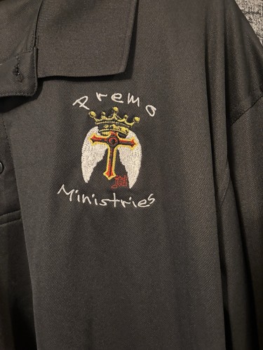 Black UltraClub Cool & Dry polo shirt featuring embroidered "Premo Ministries"2X