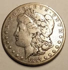 1887-P Morgan Silver Dollar....Very Good to Fine, lightly cleaned
