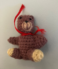 Tiny Brown Knitted Teddy Bear with Red Ribbon
