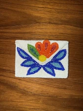 Vintage Native American Ojibwe beaded coin purse, featuring a floral design