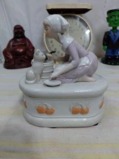 Enesco Music Box Plays “My Favorite Things" With Woman Feeding Cat Works
