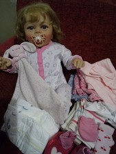 Reborn Girl Doll, with bundle of clothes. (Brought For A Christmas Present)