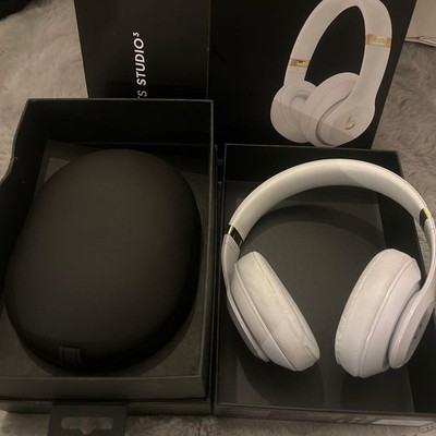 White wireless headphones with gold accents