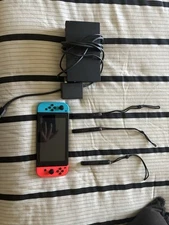 Nintendo Switch Standard with Charger, cables, and joy-con grips included