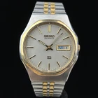 Vintage Seiko SQ Men's Gold Silver Gray Roman Numerals Day Date Watch 6923-7040