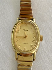 Vintage Timex Quartz Ladies H7 Analog Gold Face Oval Stretch Band Watch