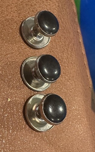 Three fixed shank  tuxedo shirt studs with black stones inset in steel