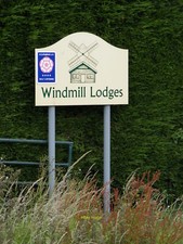 Photo 12x8 Windmill Lodges Sign Off Marlborough Road c2011