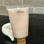 White tube of Tarte Amazonian Clay 16-Hour Full Coverage Foundation with black text reading “12B Fair Beige” and www.tarte.com.