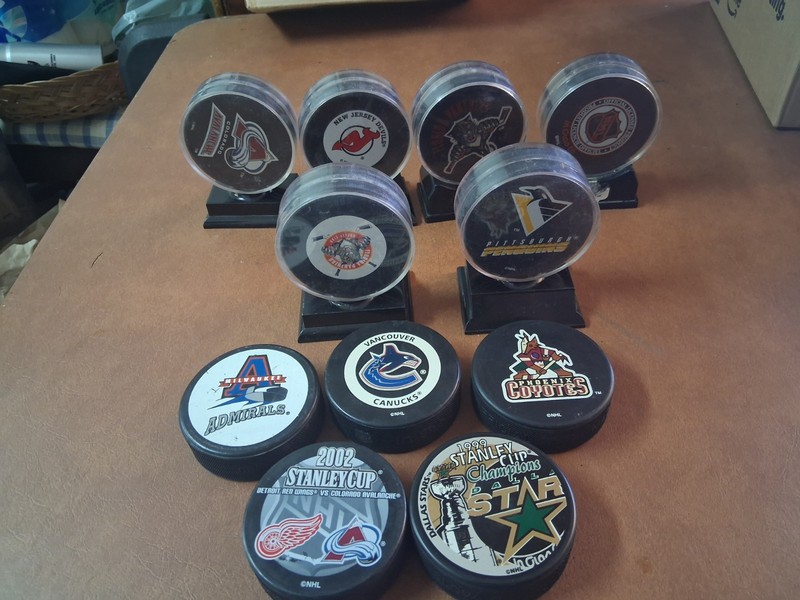  Lot of 11 Hockey Pucks 