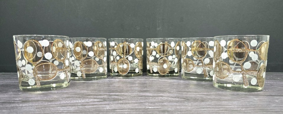 Georges Briard MCM rocks glasses shaped like tennis rackets — signed mid-century barware that doubles as sculptural art.