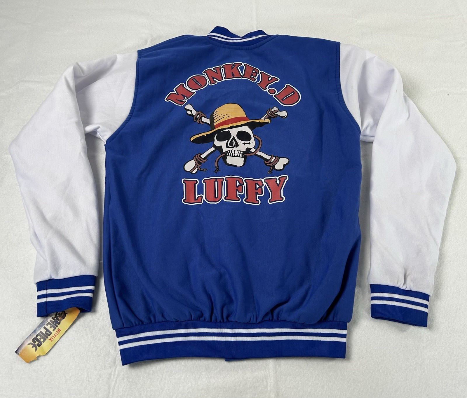 NUEVO CON ETIQUETAS Netflix Anime One Piece Chaqueta Universitaria Hombre Grande Azul Mono.D Luffy