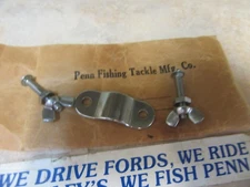 3553                VIRGIN Penn Part # 33-200 Reel Clamp..Fits Std. Penn Reels