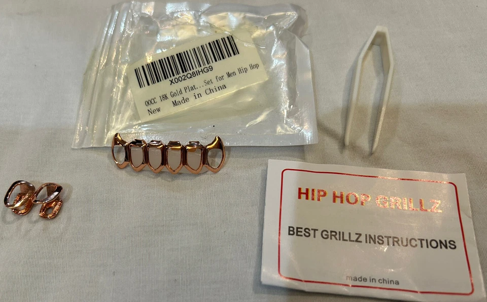 Dientes de hip hop chapados en oro de 18 quilates Grillz oro rosa... Dang That’s Hot. Y se envía rápido Foto 2 de 3