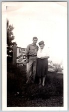 Vtg B&W Snapshot Man in Uniform & Woman By Modern Deluxe Cabins Sign 1940s