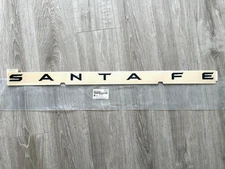 Genuine OEM Matte Black Emblem Badge 86310-P6100 for 2024-2025 Hyundai Santa Fe