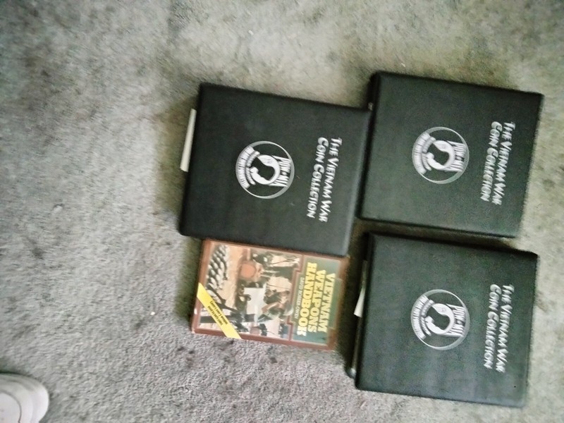THE VIETNAM WAR COIN COLLECTION WITH VIETNAM WEAPONS HANDBOOK