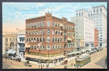 1910s Postcard Howard & Riverside Spokane WA Busy Corner Streetcar Scene