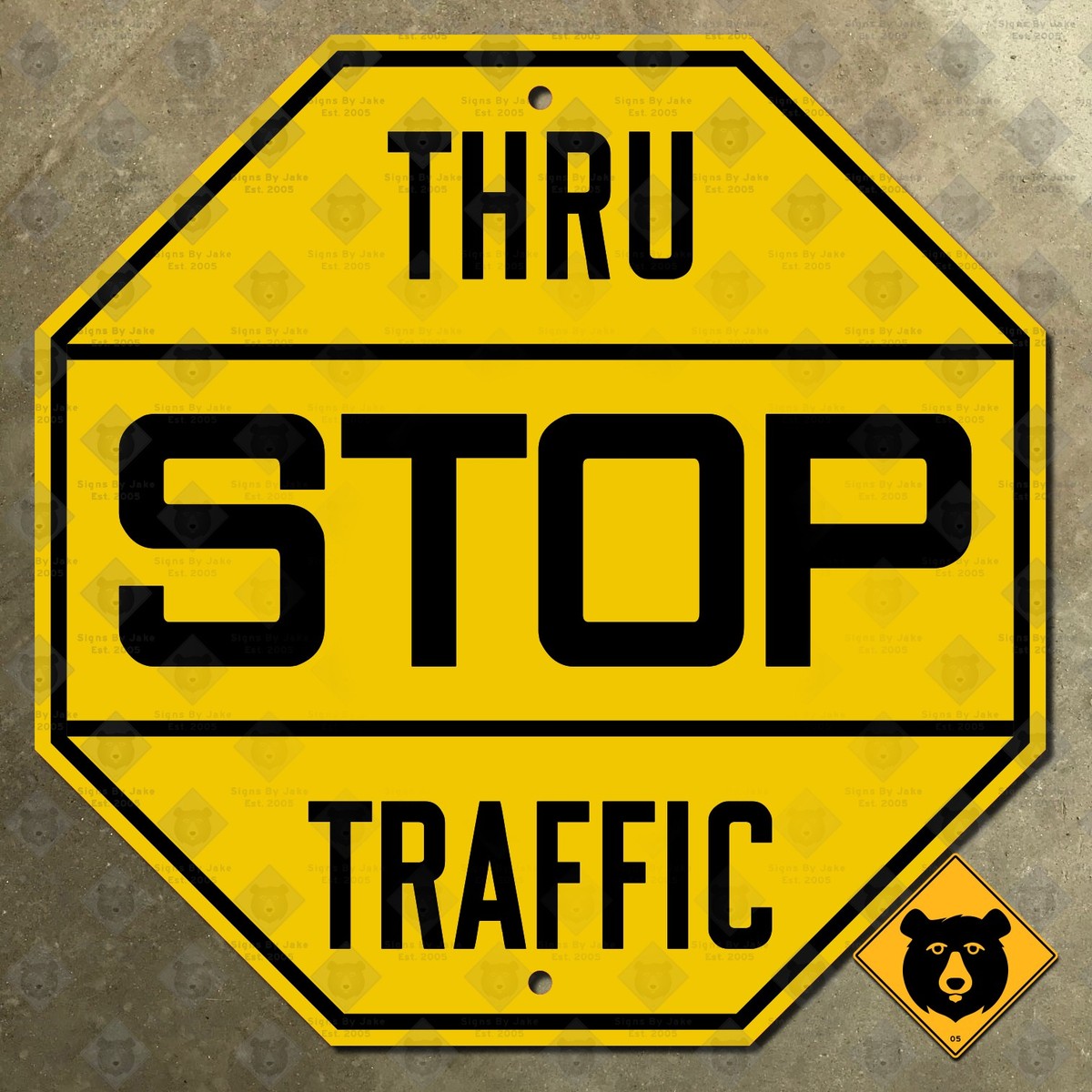 United States yellow STOP thru traffic highway road street sign