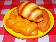 Basket of bread croissant bread twist french Italian sesame bread play food lot