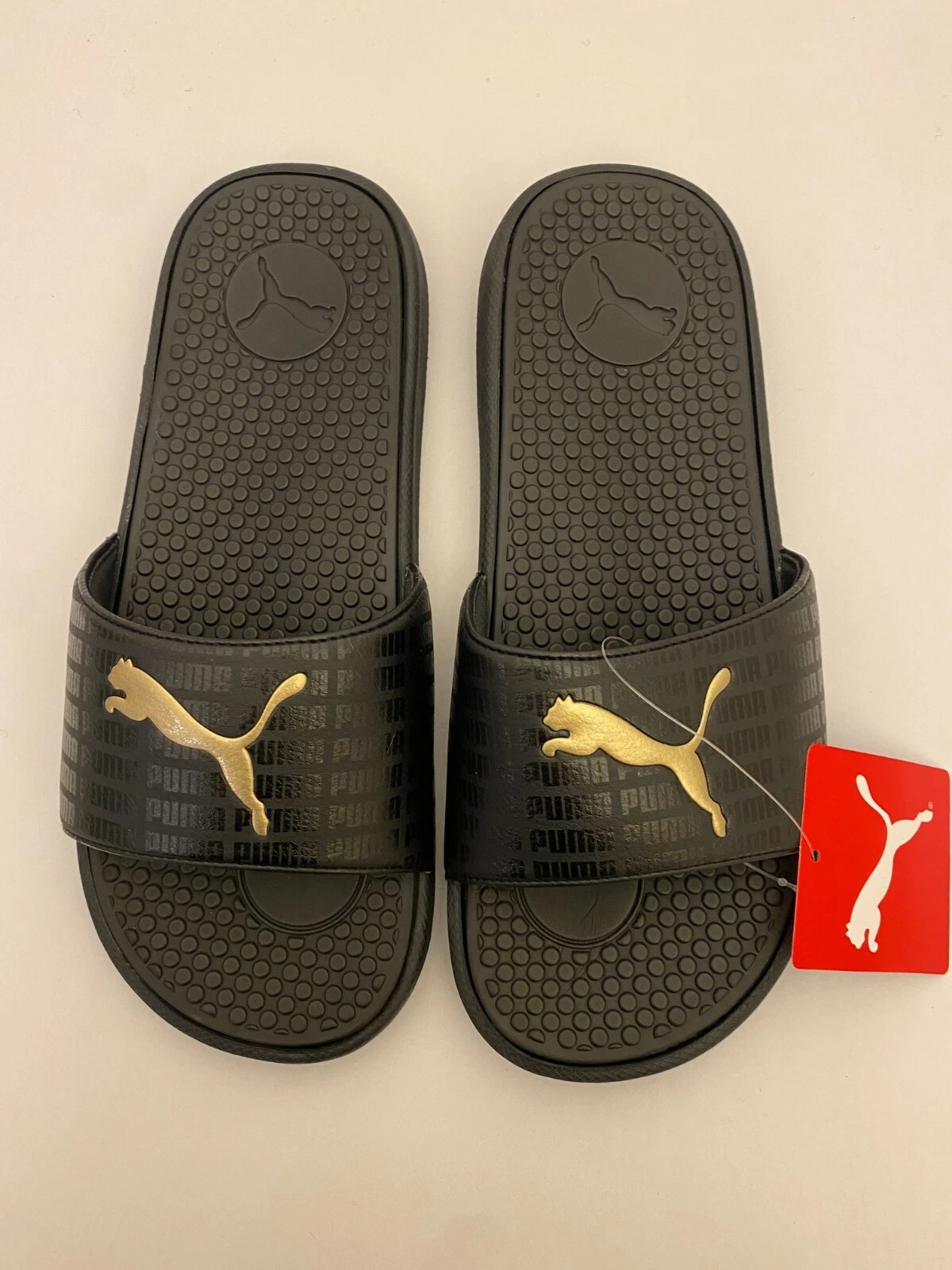 Nuovi sandali autentici da donna PUMA Cool Cat Echo neri con diapositive oro taglia 10