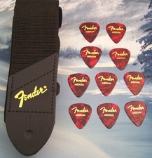 GUITAR STRAP  GENUINE FENDER  BLACK w/ GOLD LOGO  10 MEDIUM RED 351 PICKS