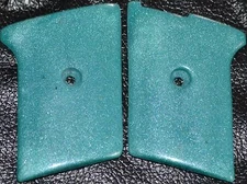 Phoenix Arms Raven 25 ACP pistol grips teal smooth slide safety plastic