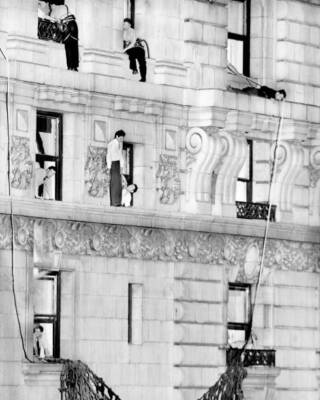 John Warde watches on 17th floor ledge of Gotham Hotel as firemen  .. Old Photo