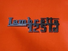 LAMBRETTA LD 125 1951 ONWARDS POLISHED STAINLESS STEEL FRONT LEGSHIELD BADGE