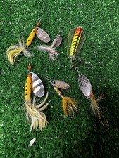 Assortment of vintage trout fishing lures with feathered tails treble hook weigh