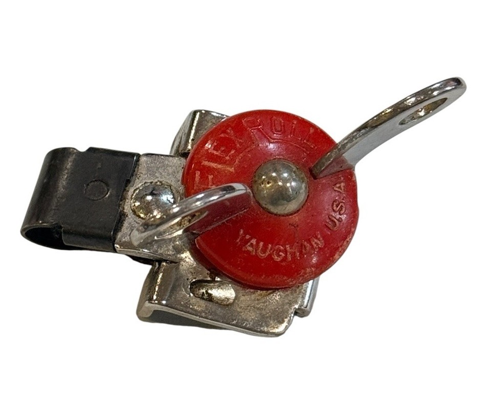 A 1951 EKCO can opener with a red Bakelite knob — a gorgeous slice of mid-century American industrial design that still works and looks killer on a retro kitchen wall.