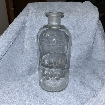 Pharmaceutical Bottle Embossed with ''Alcohol'' and the Chemical Formula C2H5OH