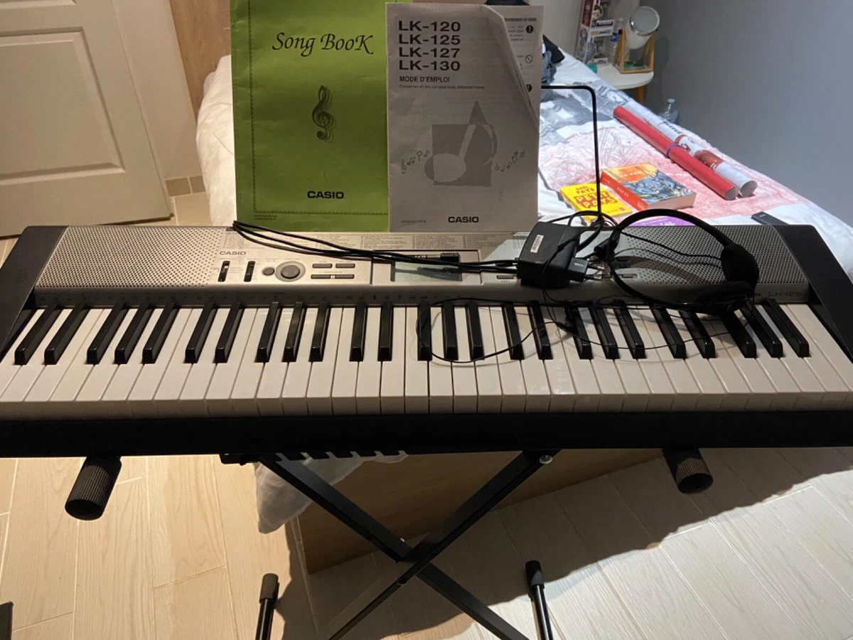 À vendre synthétiseur Casio LK-125 avec trépied pliable