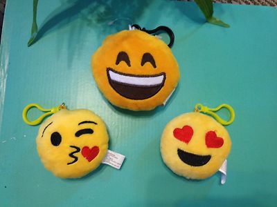 Soft emojis with plastic clips; clips on key ring