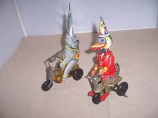 VINTAGE SCHYLLING LOT COLLECTOR SERIES DUCK ELEPHANT ON A BIKE WIND UP TIN TOY