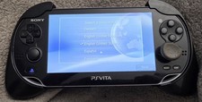 Sony Ps Vita pch- 1001 comes with charger,1 game, and 8gb storage card 