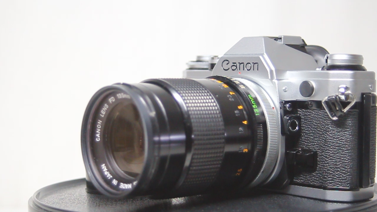 Canon AE-1 SLR 35mm Film Camera Silver + FD 135mm F/3.5 S.C Canon AE-1 SLR 35mm Film Camera Silver + FD 135mm F/3.5 S.C